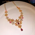Vintage gold floral necklace with pink and yellow rhinestones and magenta teardrop pendant - Necklace / Gold-Pink