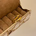 Close-up of vintage 18k gold plated rings with tiger's eye and yellow zircon gemstone - Stacked Open Ring (HR2770) / Gold Brown