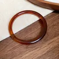 Elegante bracciale rigido geometrico in acrilico ambra con finitura liscia e lucidata - Bracciale 75# - Ambra