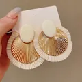 Bohemian gold and raffia straw fringe drop earrings for a stylish beach vacation look - Tassel Oval Style (1#) / Steel Earring Post / White
