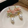 Close-up of elegant French vintage rose earrings with pearls and iridescent bows - Pink Rose Iridescent Bow Pearl Earrings (21#)