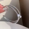 Elegant double-layer silver bangle with sparkling zircons and pearls for women. - Double Layer Cuff Bracelet / Silver
