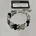 Detailed view of the beaded bracelet with heart patterns on a reflective mirror. - Transparent Heart (9#)
