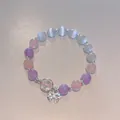 Detail view of beaded crystal bracelet with butterfly charm and pastel colored beads - Colorful Bowknot Bead Style (HB1324)