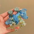 Close-up detail of blue ribbon bow earrings with heart resin and beaded floral clusters - Heart Blue Flower Bow Drop Style (12#)
