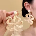 Elegant beige raffia woven flower pendant earrings for a summer beach vacation style. - Woven Large Flower Drop Style (14#)