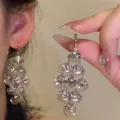 Macro view showing the detailed multi-tier silver shell earrings with cubic zirconia - Fan-shaped Shell Hook Style (9#)