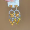Detailed macro shot of luxury court-style butterfly tassel earrings with sparkling yellow zircons - Butterfly Tassel Bold Style (14#)