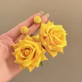 Vibrant yellow raffia flower drop earrings for beach vacations and summer fashion - Bright Yellow Rose with Green Leaves Style (19#)