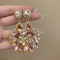 Detailed macro shot of ornate court-style earrings with champagne and clear zircon crystals - Luxury Unique Pave Style (17#)