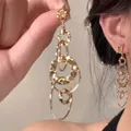 Elegant multi-layered gold hoop earrings featuring a palace style and textured ring design - Gold