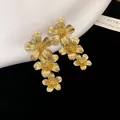 Vintage gold metal flower stud earrings featuring an elegant layered floral design - 7# Floral Shape