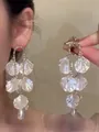 Elegant silver needle drop earrings with white petal accents and zircon detailing - White
