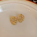 Vintage gold-toned textured geometric irregular stud earrings with hollow design. - 62# Lava Texture Geometric Style