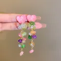Detailed close-up of vibrant colorful stone tassel earrings with pink heart tops - Style 10# Pink Heart Rhinestone Tassel