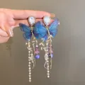 Detailed close-up of blue butterfly tassel earrings with faux pearls and crystals - Style 11# Blue Gauze Butterfly Pearl Tassel