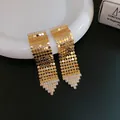 Eleganti orecchini a nappa dorati con zirconi brillanti e frangia a rete geometrica. - Stile Nappa Geometrica (5#)