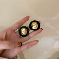 Vintage matte black and hammered gold circular stud earrings for elegant women style - Black