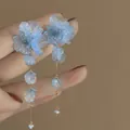 Blue translucent petal flower tassel earrings with silver needles for a fairy-like look - Blue