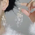 Detail shot showing clear teardrop tassel hook earrings in a gentle summer style - 6# Ear Hook Style