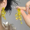 Detail shot of elegant yellow floral tassel earrings with beads for a gentle summer look. - 13# 925 Sterling Silver Earring Post Style