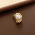 Close-up of a vintage-style ring with an irregular faux pearl in a gold setting. - French Irregular Pearl Style (WR271) / Gold