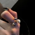 Elegant silver-tone open ring featuring a lustrous white pearl and zircon accents. - Vintage Open Pearl Style (WR271) / Silver