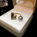 Vintage style gold plated open ring featuring rectangular zircons and a grey pearl - Gray Purple Pearl Zirconia Style (WR271) / Gold