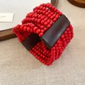 Bracciale bohémien multistrato in perle di legno rosse con inserti in legno scuro - Rosso