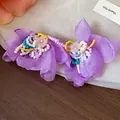 Close-up detail of elegant purple chiffon flower earrings with intricate glass beadwork - Purple