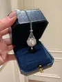 Close-up of French style pearl pendant necklace featuring a zircon-studded silver cage design. - Necklace Only (With Gift Box) / Silver