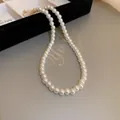 Exquisite French vintage style white artificial pearl necklace closeup showing elegant luster - Simple Premium Choker (24#)