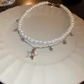 Elegant vintage double-layer necklace with white faux pearls and silver star pendants SKU - Double Layer Star Style (43#)