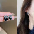 Elegant oval crystal stud earrings with black and clear crushed stones for a chic look. - Two-Tone Oval (Style 31)