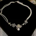 French vintage faux pearl necklace with silver floral pendant as a SKU variant. - Hollow Flower Rose Style (60#)