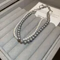 Elegant double-strand necklace with white and grey faux pearls in a grey jewelry tray - Double Layer White Gray Gradient (66#)