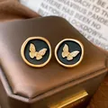 Vintage gold butterfly stud earrings with black circular base for elegant women fashion - Black & Gold Butterfly (Style 48)
