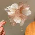 Close-up of elegant fabric flower hair fork with pearl tassel and translucent petals. - Tassel Flower Hairpin / Brown