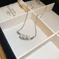 Elegant silver-tone necklace featuring three pearls on a curved bar pendant detail - Triple Pearl Geometric Metal Base (69#)