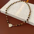 Vintage brown tiger eye beaded necklace featuring a crystal-paved heart pendant in gold. - Heart Rhinestone Pendant (48#) / Gold Brown