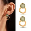 Detailed view of gold-colored stud earrings with green inlay and tiered ring design - Triple Ring Intertwined Style (1#)