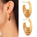 Detailed view of fashionable gold stainless steel tiered hoop earrings worn by a model - Layered Wave Style (14#)
