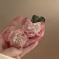 Detailed view of delicate pink organza flower earrings with pearl stamens - Fabric Flower Style (1#)