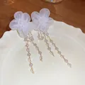 Elegant silver needle earrings featuring white mesh flowers and hanging pearl tassels. - Mesh Pearl Tassel Style (52#)