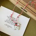 Vintage style necklace featuring a white dog pendant and colorful beads on red white cord - West Highland Terrier Braided Necklace / Red-White Puppy