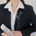 Exquisite silver-toned phoenix brooch with elegant pearl tassels on a black blazer - Gun Black