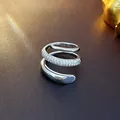 Detailed view of a silver-toned spiral open ring with pavé-set clear cubic zirconia. - Snake Three-Layer Style (3#)