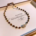 Vintage Maillard tiger's eye beaded necklace with a sparkling pave crystal ball pendant - Disco Pave Ball Pendant Necklace