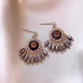 Macro view of bohemian fan-shaped earrings with crystal and bead tassel details. - 5# Gold-Pink-Black