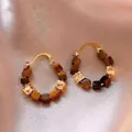 Close-up of bohemian gold hoop earrings featuring tiger's eye stone and metal cubes - 11# Gold-Coffee